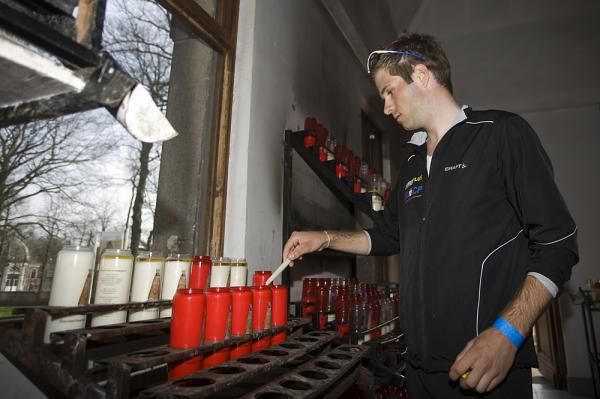 Niels Albert lights a candle at the basilica in Scherpenheuvel