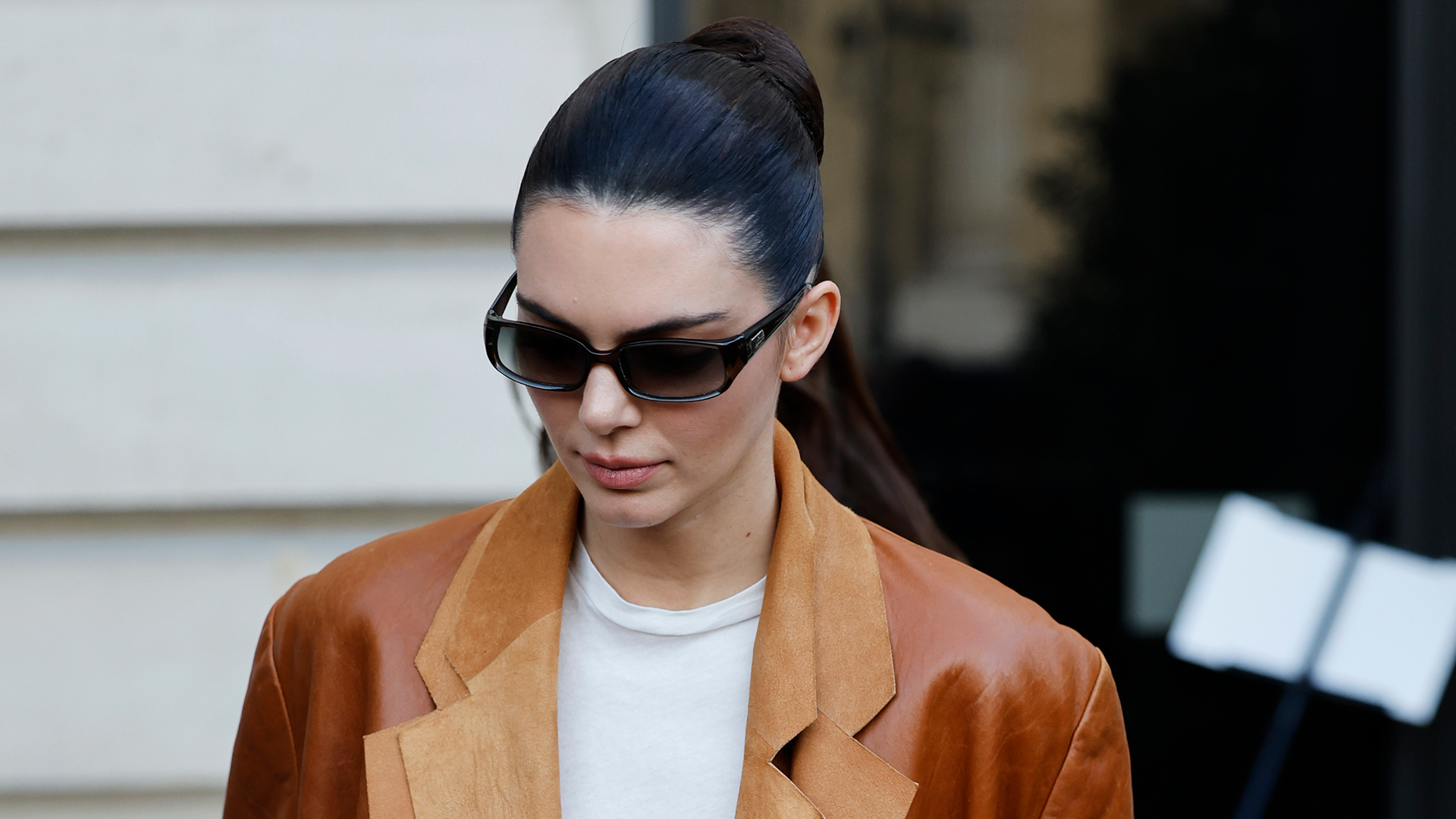 Kendall Jenner goes full cowboy-core in jeans and cowboy boots.
