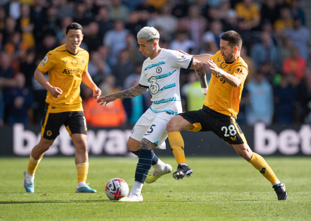 Enzo Fernandez of Chelsea in action with Joao Moutinho and Hwang Hee-Chan of Wolverhampton Wanderers during the Premier League match between Wolverhampton Wanderers and Chelsea FC at Molineux on April 8, 2023 in Wolverhampton, United Kingdom. (Photo by Joe Prior/Visionhaus via Getty Images)