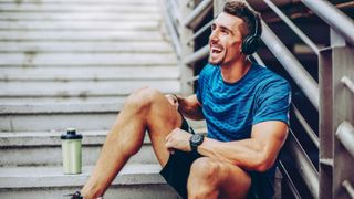 How to make your workout goals last - a happy man smiling after a workout 