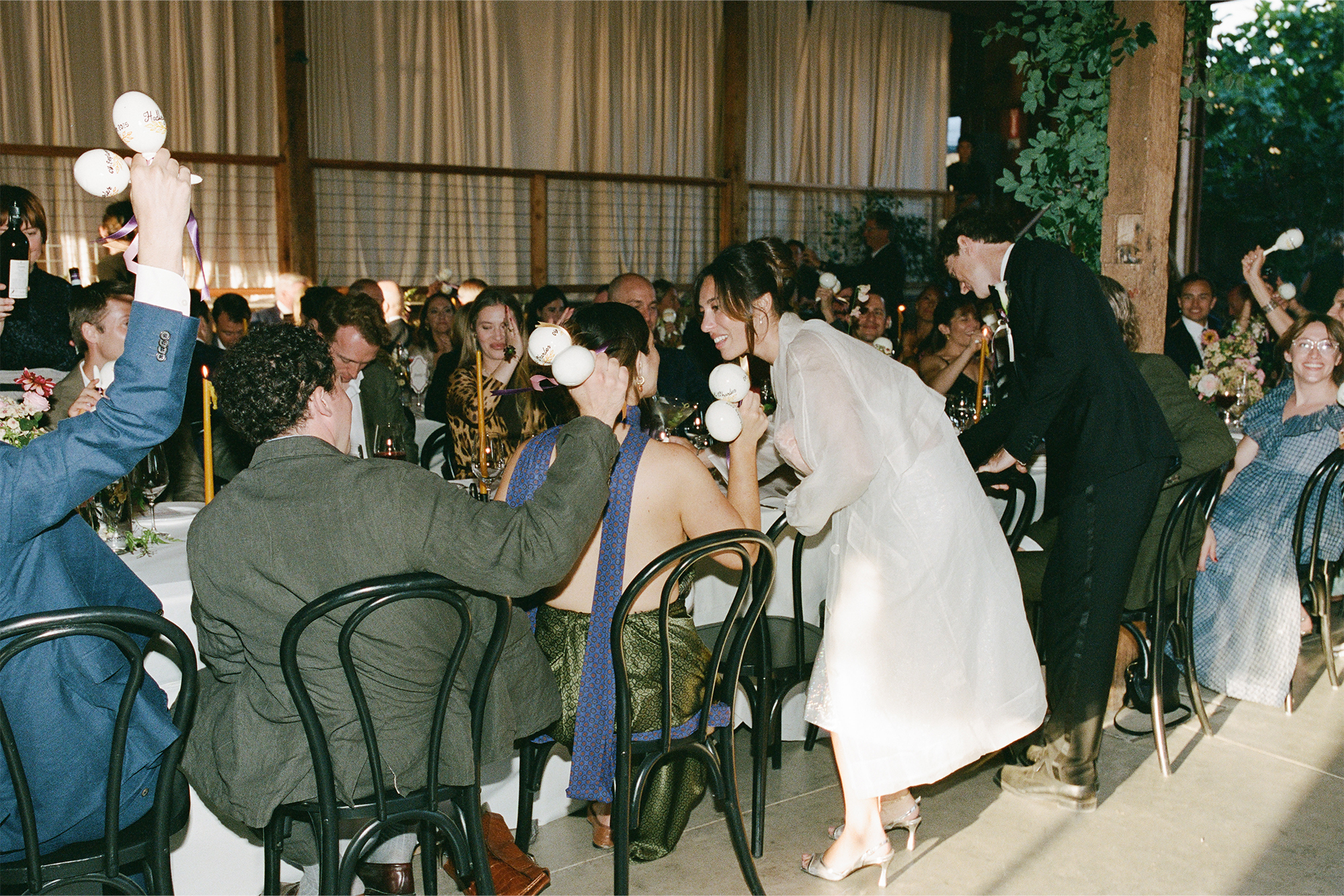 Hadley and Charles talking to friends at the table.