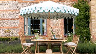 Scalloped-edge parasol in garden