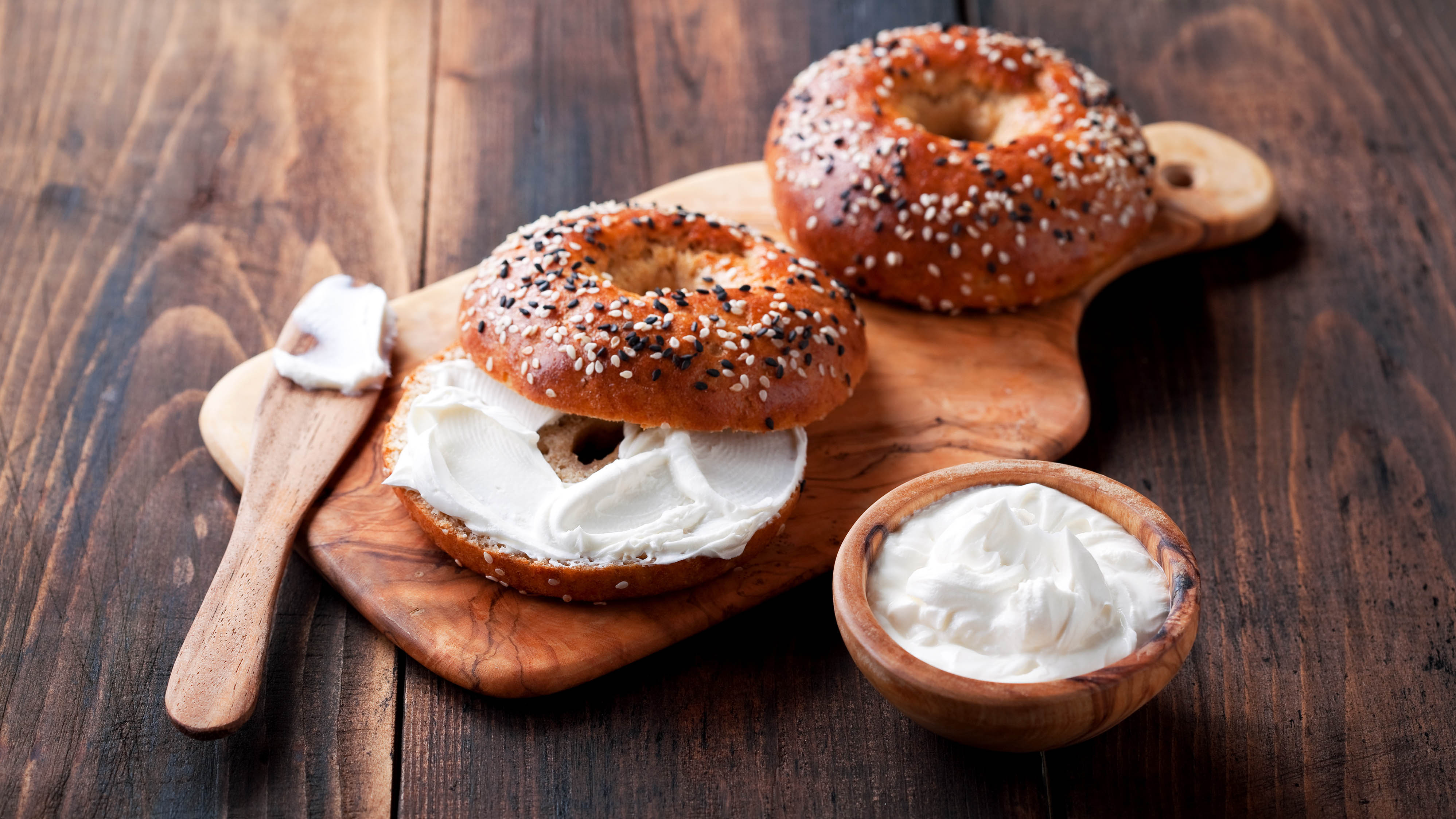 Spread the cream cheese on the bread with the side of the knife