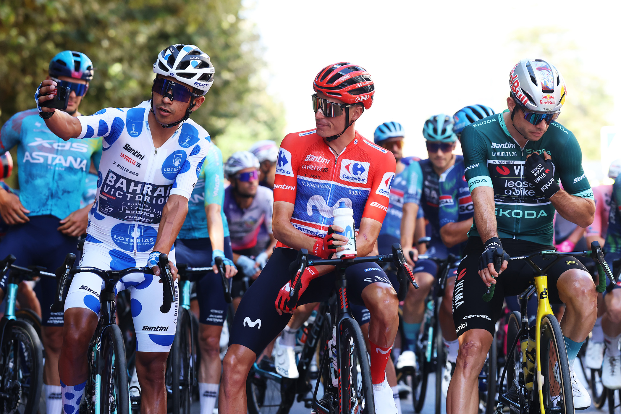VELEZ-MALAGA​, SPAIN - SEPTEMBER 11: (L-R) Santiago Buitrago of Colombia and Team Bahrain Victorious - Polka dot Mountain Jersey, Enric Mas of Spain and Movistar Team - Red Leader Jersey, Wout Van Aert of Belgium and Team Visma | Lease a Bike - Green points jersey prior to the La Vuelta - 81st Tour of Spain 2026, Stage 19 a 210.8km stage from Velez-Malaga to Pe&ntilde;as Blancas. Estepona 1274m / #UCIWT / on September 11, 2026 in Velez-Malaga, Spain. (Photo by Alexander Hassenstein/Getty Images)