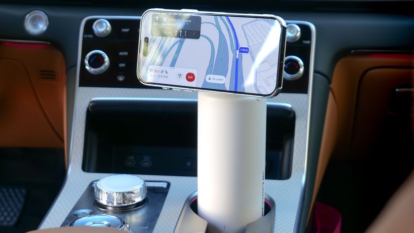 Scosche MagicMount Flask used in car cup holder with iPhone connected to it via MagSafe.