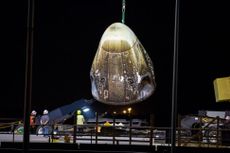 The SpaceX Crew Dragon capsule emerges from the Atlantic following an uncrewed trip to the International Space Station March 8, 2019. This same capsule was apparently damaged during a safety test April 20.