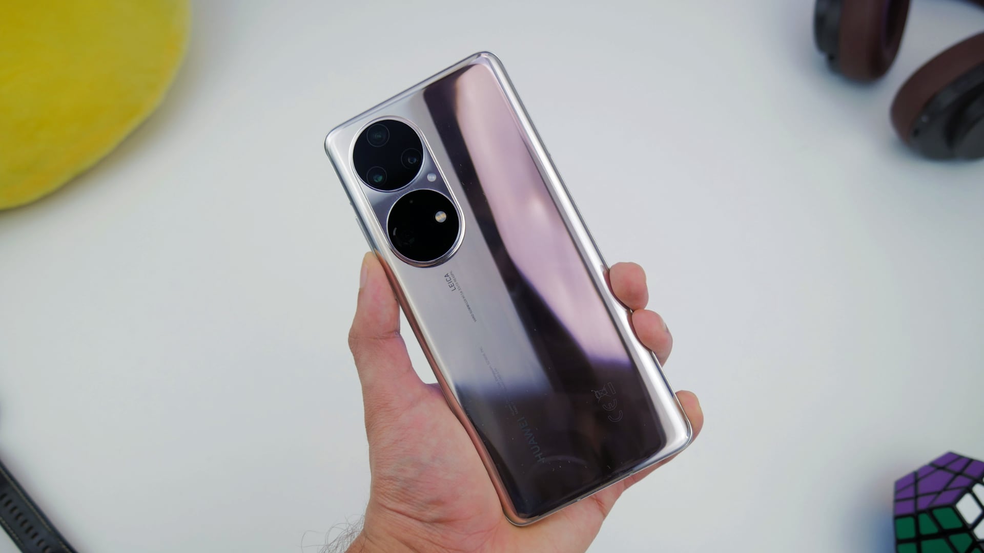 A Huawei P50 Pro held in one hand