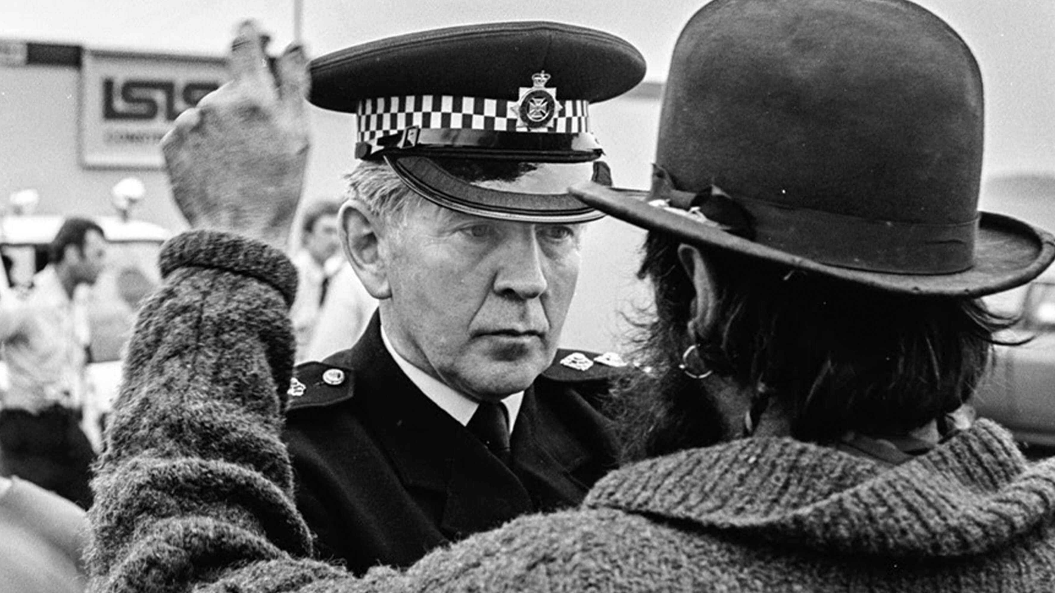 Police confronts protester. 