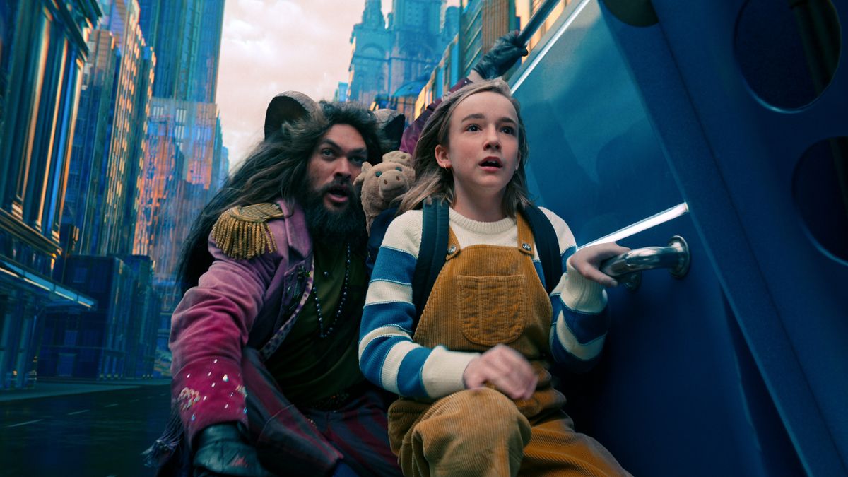 Jason Momoa and Marlow Barkley hang onto a speeding vehicle in Slumberland.