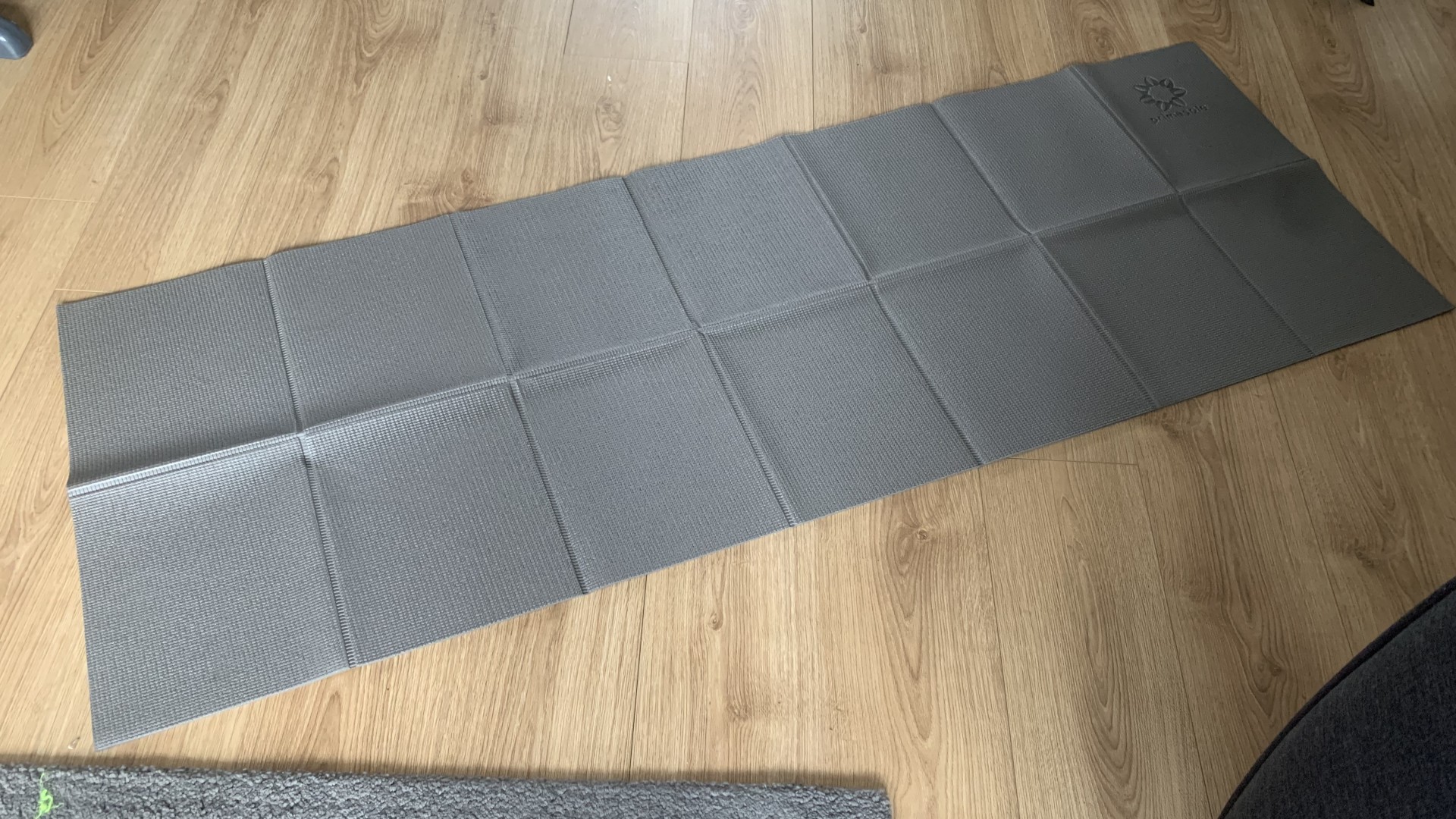 Primasole folding yoga mat unfolded and laid out for use