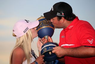Patrick and Justine kiss the trophy