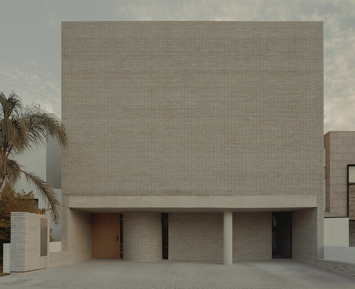 Mexican house designed as a refuge, tall walls, blind from street, plants and minimalist serenity inside