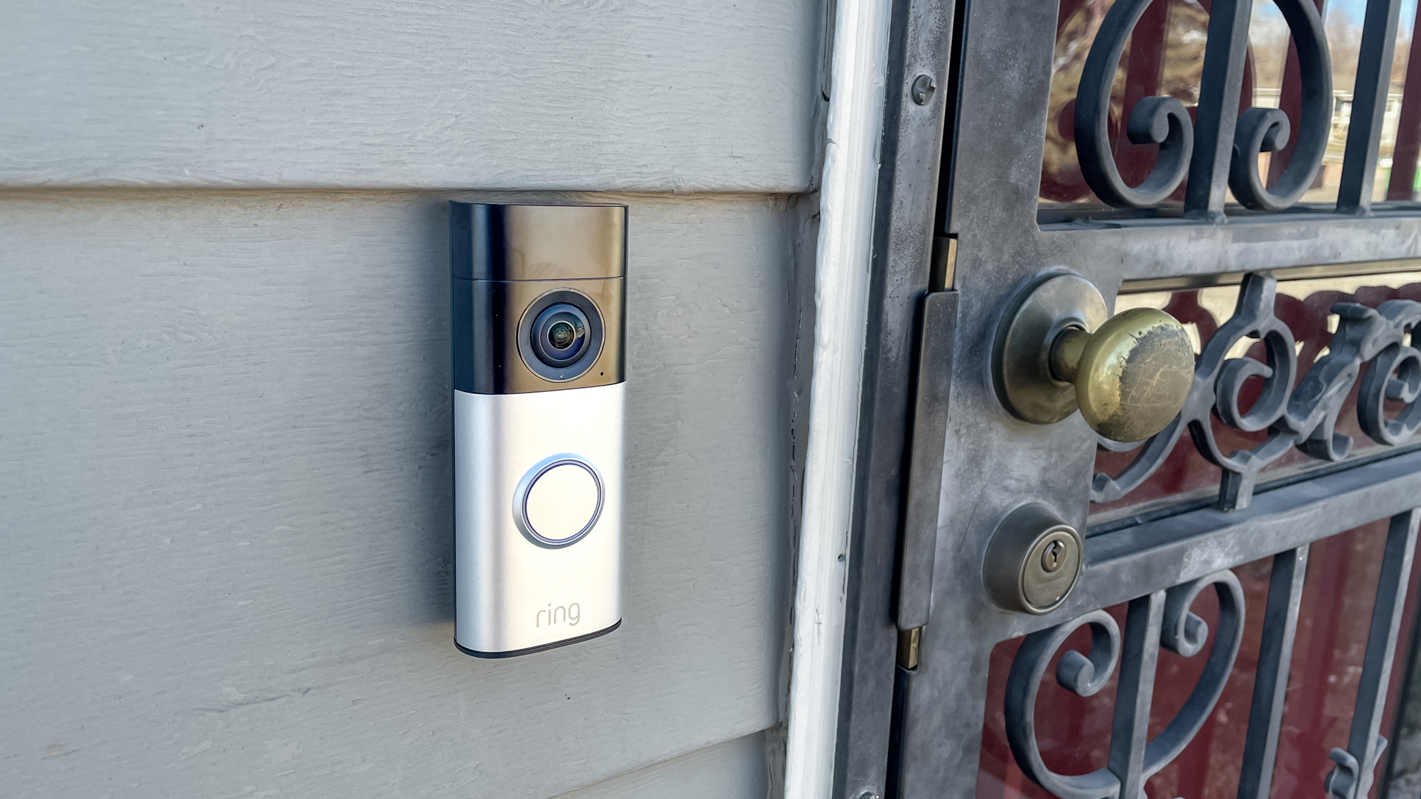 Ring Wired Doorbell Plus (2nd gen) mounted next to a front door