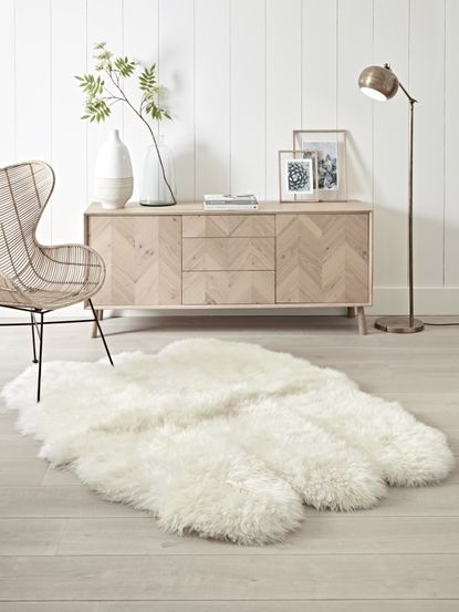 fluffy sheepskin rug in living room with neutral scheme