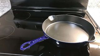 Staub 11-inch Traditional Cast Iron Skillet on glass top stove