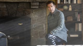 Dylan McDermott as Supervisory Special Agent Remy Scott next to a fireplace in FBI: Most Wanted season 5