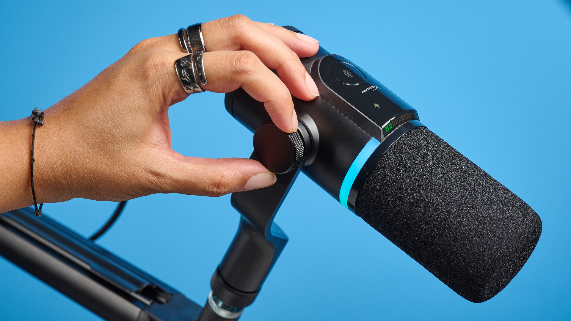 the hyperx flipcast streaming microphone on a boom arm with an RGB LED panel and an xlr and usb-c connectivity
