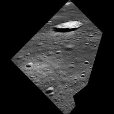 A simulated view of what Apollo 11's Neil Armstrong saw as the Lunar Module Eagle approached the aim point on the northeast flank of the 620-foot-wide (190 meters) West Crater. The odd shape of the image area is due to the small windows in the Eagle. Nort