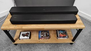 two soundbars on a wooden table