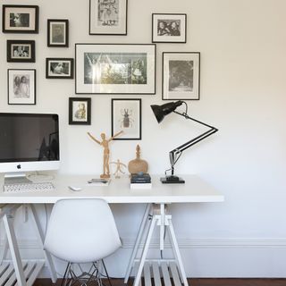 Monochrome home office with gallery wall