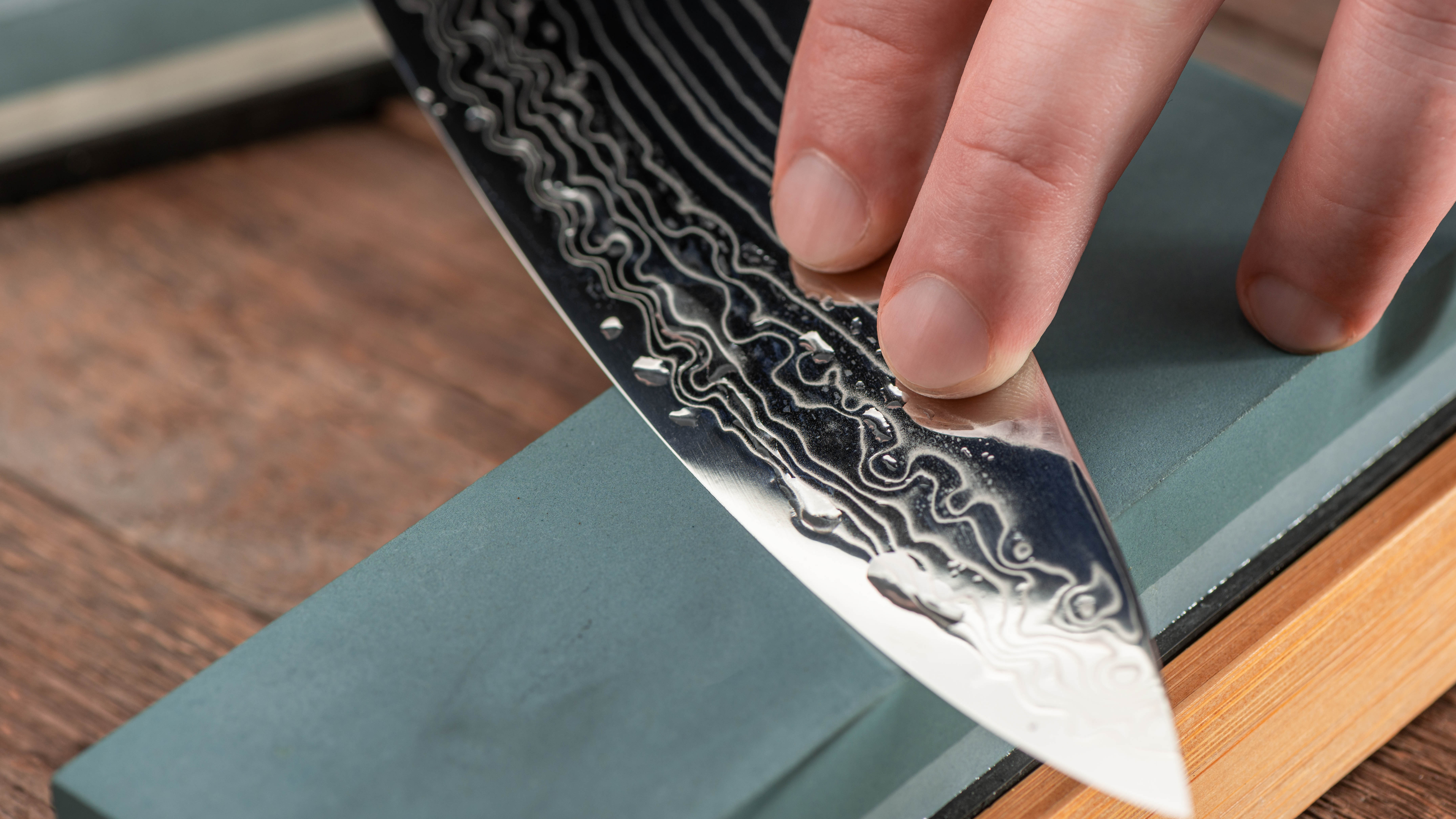 knife sharpening on a grindstone