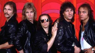 Scorpions standing in front of a red wall in 1994