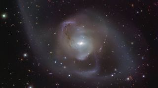 galaxy surrounded by wispy arms