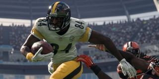 A running back breaks a tackle in Madden