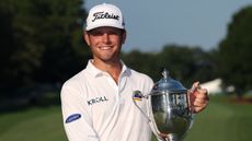 Michael Brennan with the Wyndham Championship trophy