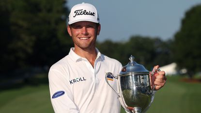Michael Brennan with the Wyndham Championship trophy