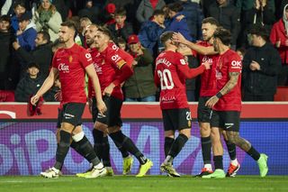 Mallorca players celebrate after scoring against Girona in March 2024.