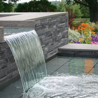 water feature with flower and trees
