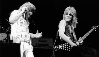 Ozzy Osbourne (left) and Randy Rhoads perform onstage at the Gaumont Theatre