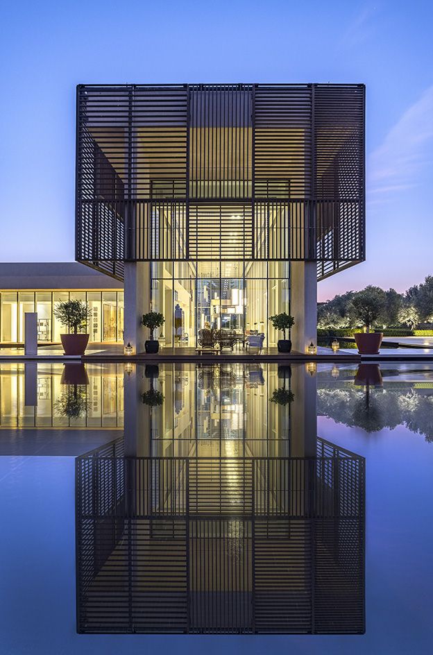 Night-time illuminated exterior of Piero Lissoni's Al-Zorah Oberoi Beach Resort