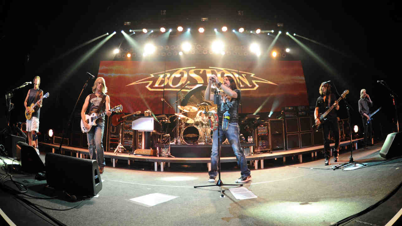 Boston performing onstage in 2012