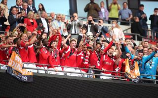 Salford City players celebrate at Wembley (PA)