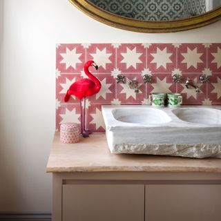 room with printed wall and washbasin