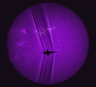 Using the solar disk as a backdrop, its details revealed by a calcium-K optical filter, researchers processed this image to reveal shock waves created by a supersonic T-38C.