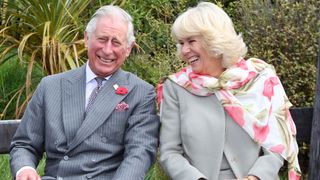 King Charles and Queen Camilla laugh during their visit to the Orokonui Ecosanctuary