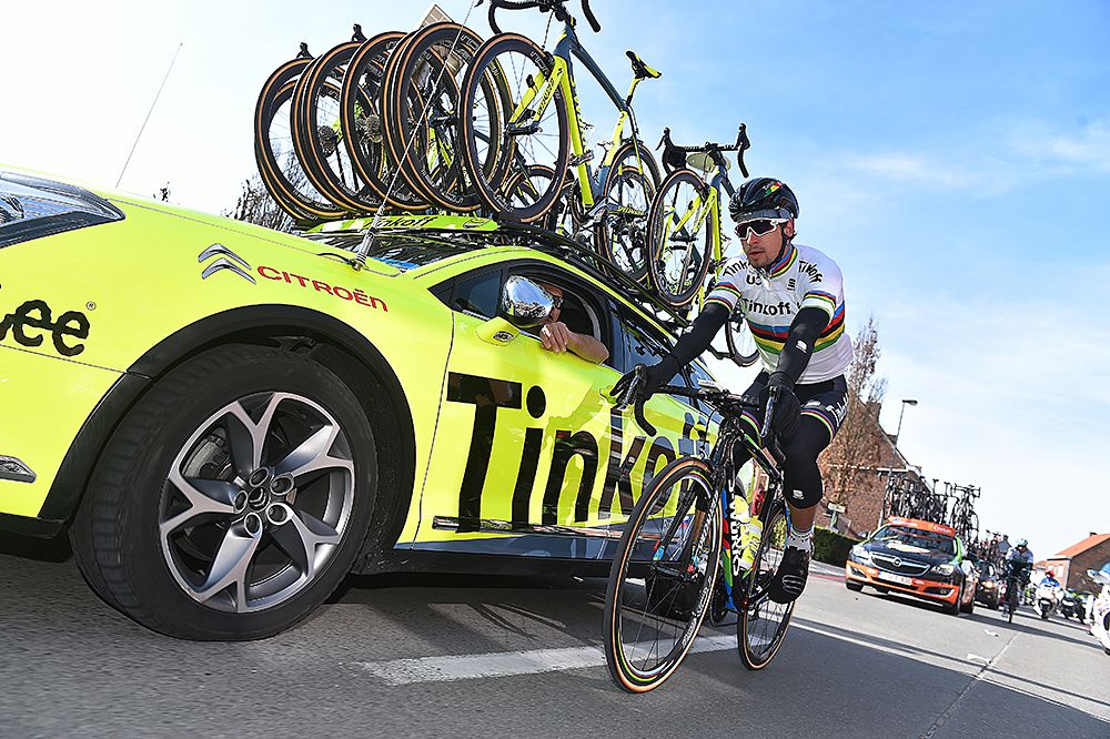 Peter Sagan (Tinkoff) rides next to his team car at Kuurne-Brussel-Kuurne