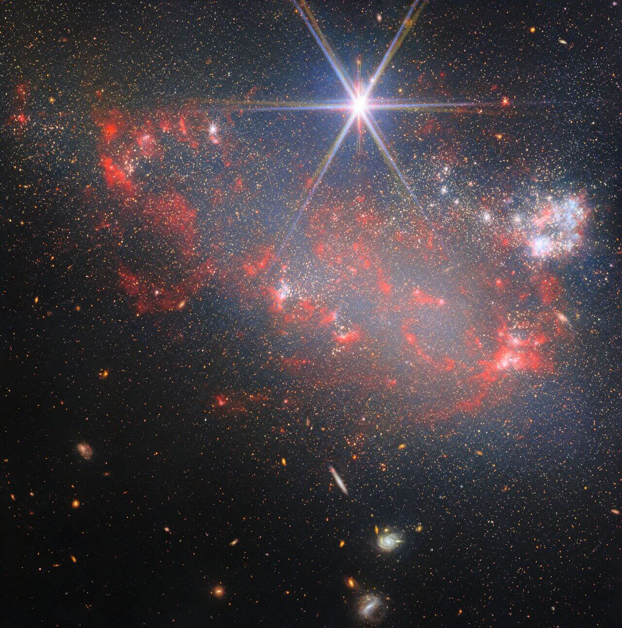 Galaxy wit bright star appearing in the foreground.