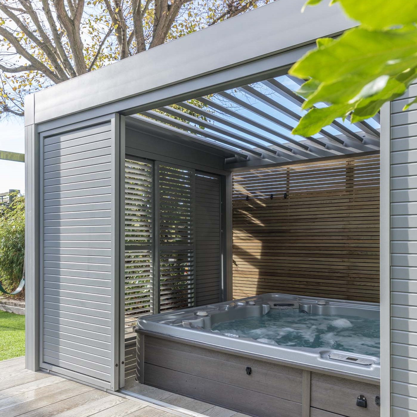 Renson Camargue Louvered Canopy with Hot Tub by Garden House Design in Sussex