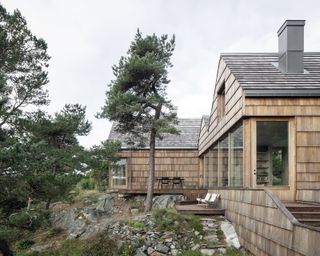 Saltviga House, on the south coast of Norway by Architects Kolman Boye Architects , seen here sat on a rocky outcrop