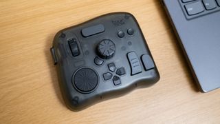 TourBox Elite next to a laptop on a desk