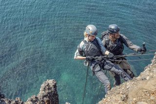 Brie and Bear abseil down a cliff