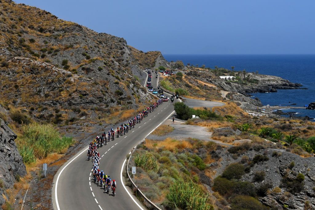 CABO DE GATA SPAIN AUGUST 31 A general view of the peloton passing through a sea landscape during the 77th Tour of Spain 2022 Stage 11 a 1912km stage from ElPozo Alimentacin Alhama de Murcia to Cabo de Gata LaVuelta22 WorldTour on August 31 2022 in Cabo de Gata Spain Photo by Justin SetterfieldGetty Images