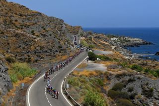 CABO DE GATA SPAIN AUGUST 31 A general view of the peloton passing through a sea landscape during the 77th Tour of Spain 2022 Stage 11 a 1912km stage from ElPozo Alimentacin Alhama de Murcia to Cabo de Gata LaVuelta22 WorldTour on August 31 2022 in Cabo de Gata Spain Photo by Justin SetterfieldGetty Images