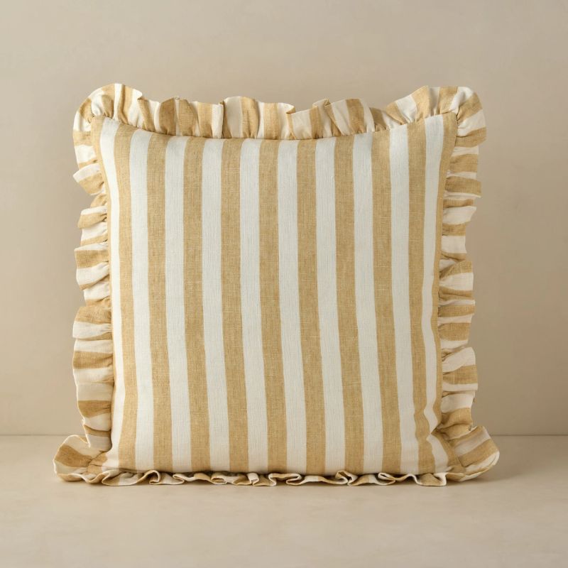 butter yellow striped pillow with ruffled edges