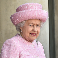 Queen Elizabeth wears a bubblegum pink suit and matching hat