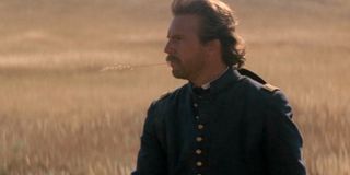Kevin Costner stands in a field in Dances with Wolves
